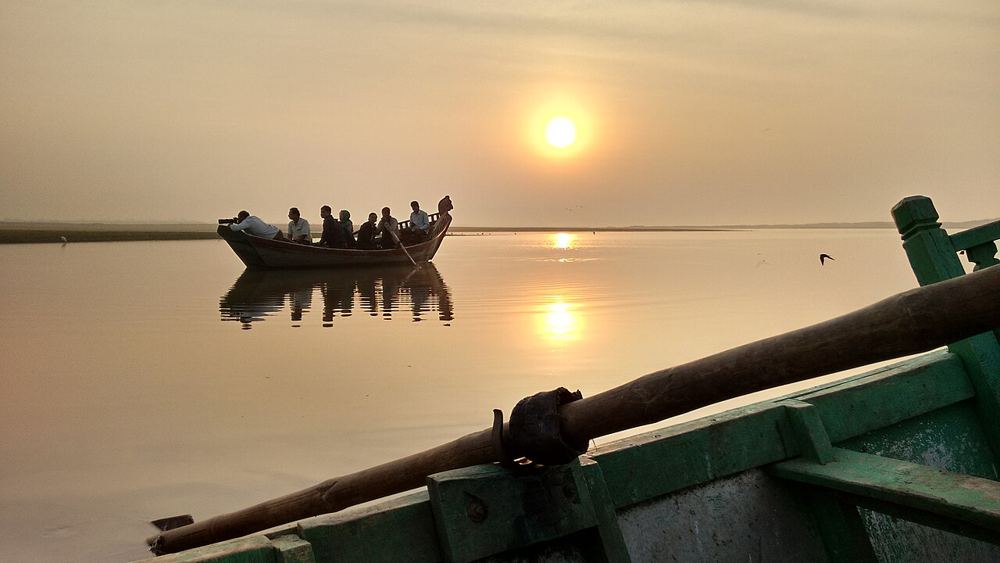 A boat on the backwater at sunrise