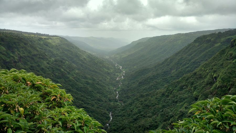Green Sahyadri valley with a river far below